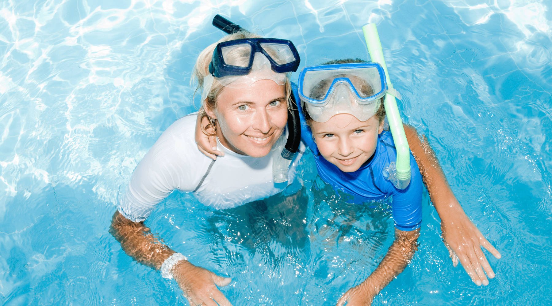 Mom and Daughter wearing swim goggles with nose cover