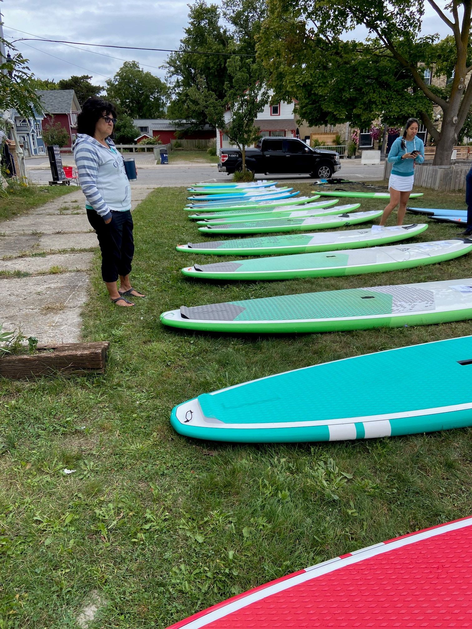 Paddleboards laid out for sale | Choosing the right Length of paddle board