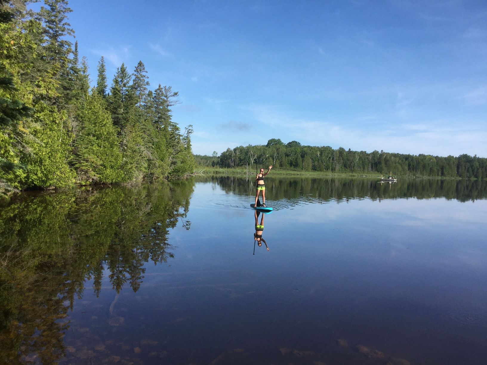 Inflatable paddle board in small lake