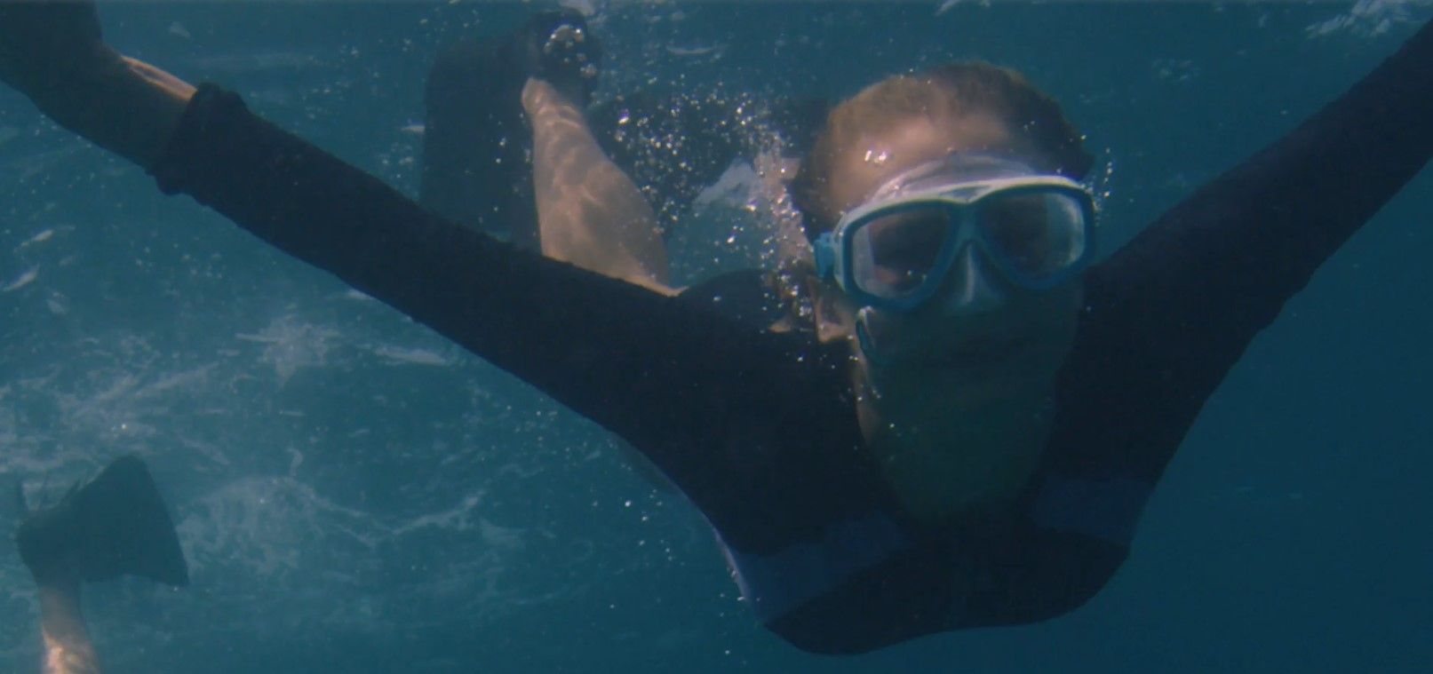 Speedo Adult Adventure Swim Goggles with Nose Cover on swimmer underwater.