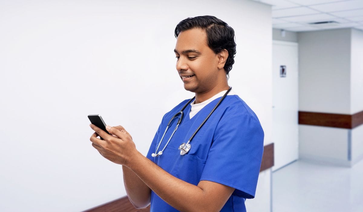 Nurse with smartphone at the hospital