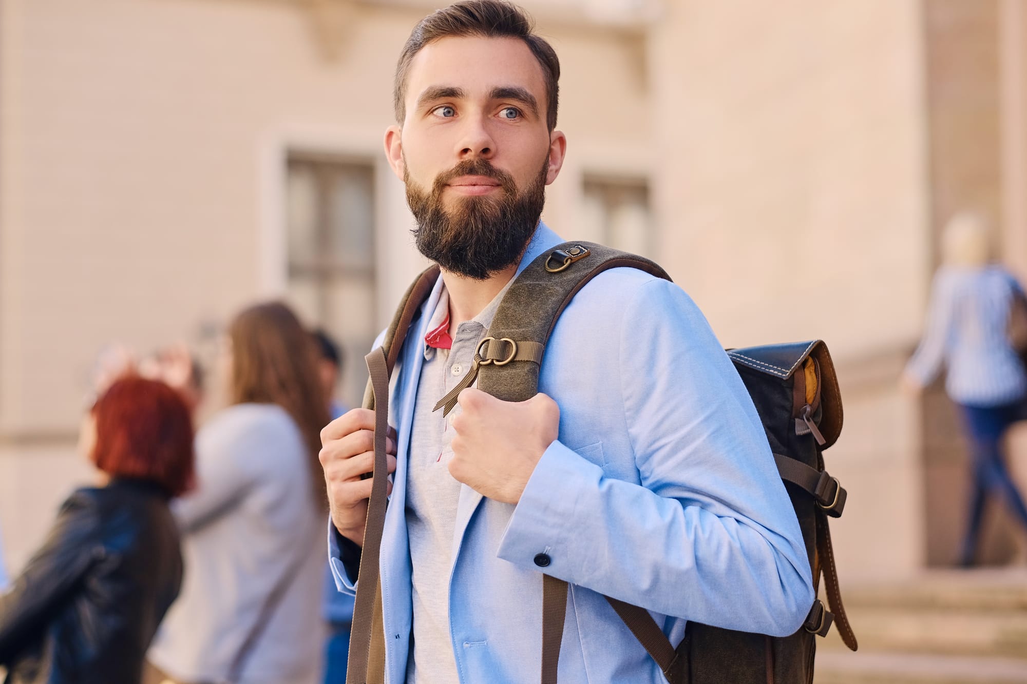 male teacher with backpack